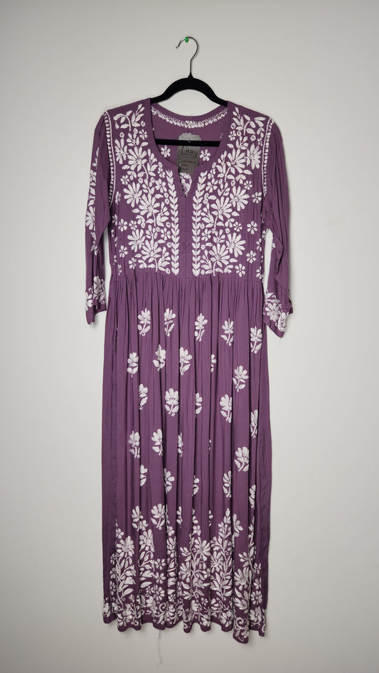 Purple dress with white floral patterns on a light gray background. Shop the world’s first best collection of elegant kurtis, beautiful maxi dresses, and premium cordsets—affordable, stylish, and crafted for boutique lovers in Auckland, New Zealand, and Australia. Premium quality meets cheap prices in fashion that’s both modest and stunning.