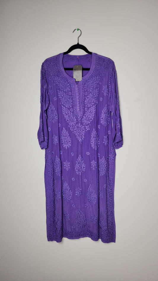 Purple garment with floral pattern on a light gray background. Premium kurti with embroidery—cheap price, high impact.
