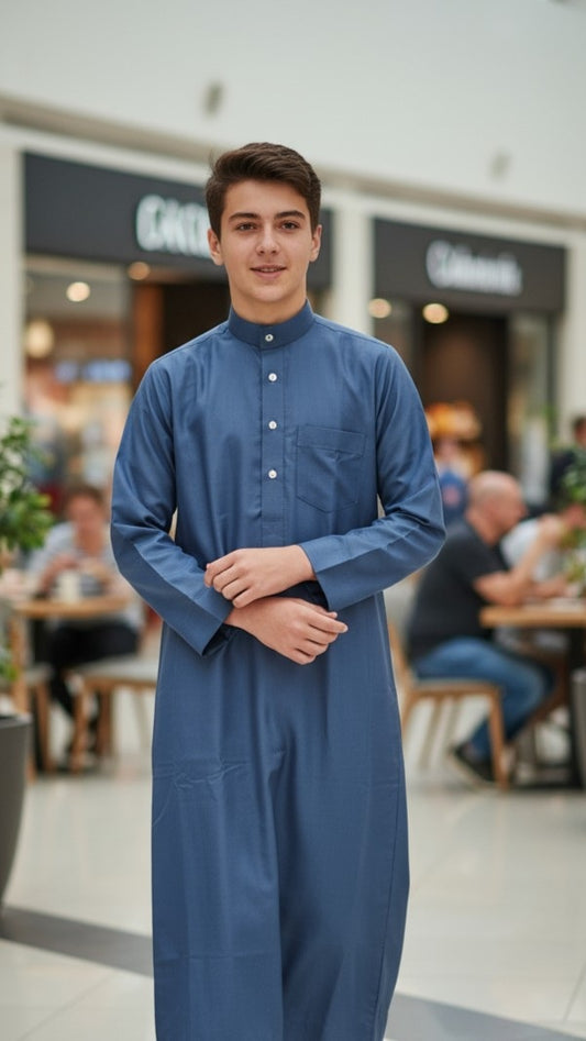Teen boys’ thobe with modern tailoring, subtle embroidery, and boutique craftsmanship. A stylish jubba for youth celebrating Eid, attending Islamic school, or expressing cultural pride in Sydney, Auckland, and the Middle East