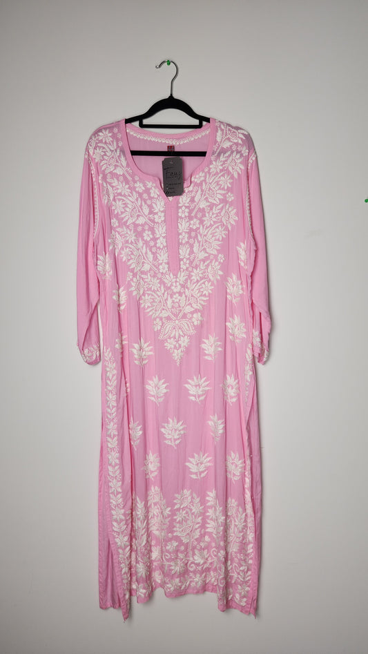 Pink floral dress on a hanger against a plain background. Discover the world’s first best collection of elegant kurtis, beautiful maxi dresses, and premium-quality cordsets—crafted with care and designed to elevate modest fashion across Auckland, New Zealand, and Australia. Whether you're seeking affordable luxury or cheap chic, each piece blends boutique craftsmanship with stunning detail, offering the best in style without compromising on quality. From soft fabrics to graceful silhouettes, this collection