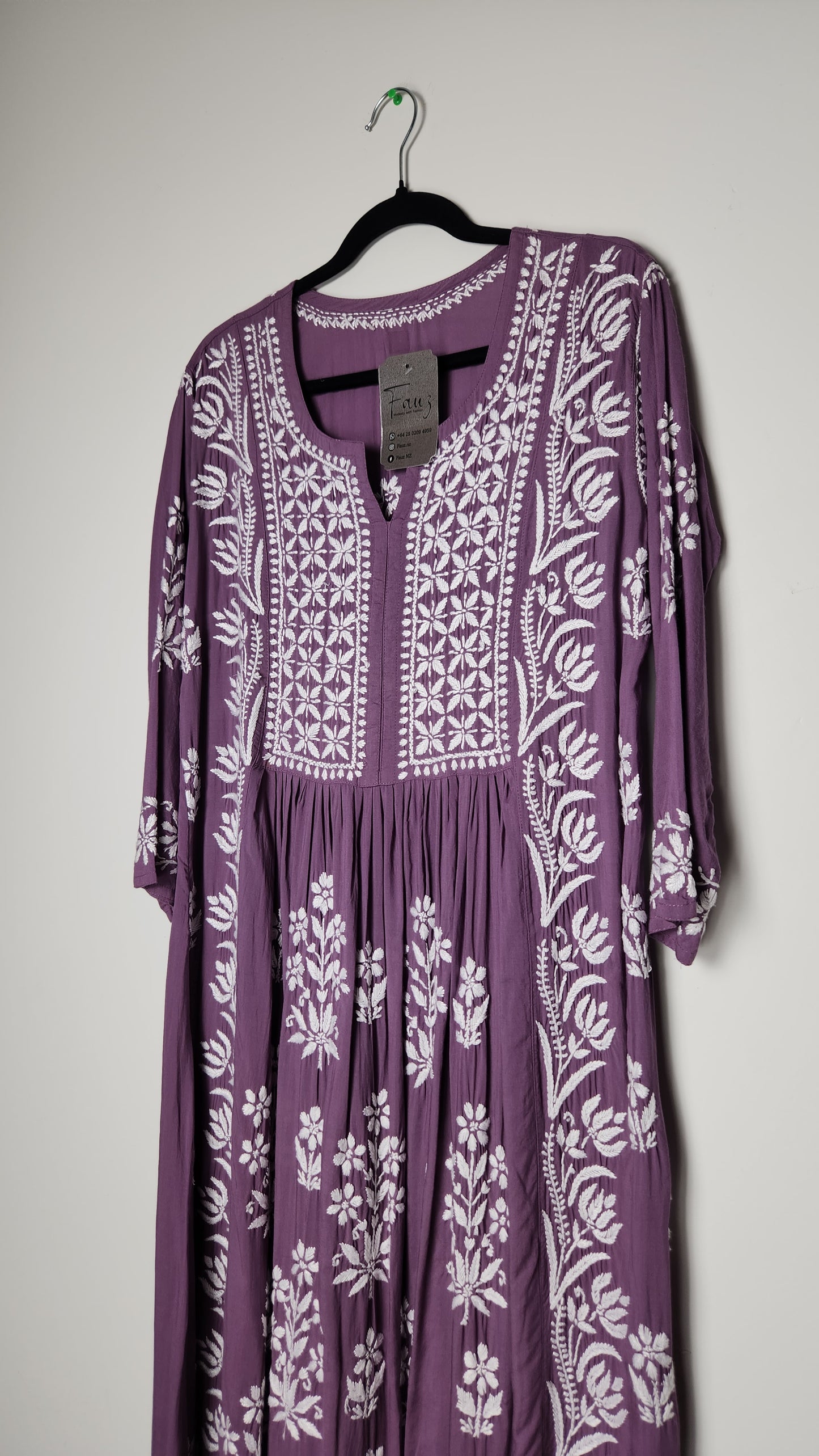 Purple dress with white floral pattern on a light gray background. Shop the world’s first best collection of elegant kurtis, beautiful maxi dresses, and premium cordsets—affordable, stylish, and crafted for boutique lovers in Auckland, New Zealand, and Australia. Premium quality meets cheap prices in fashion that’s both modest and stunning.