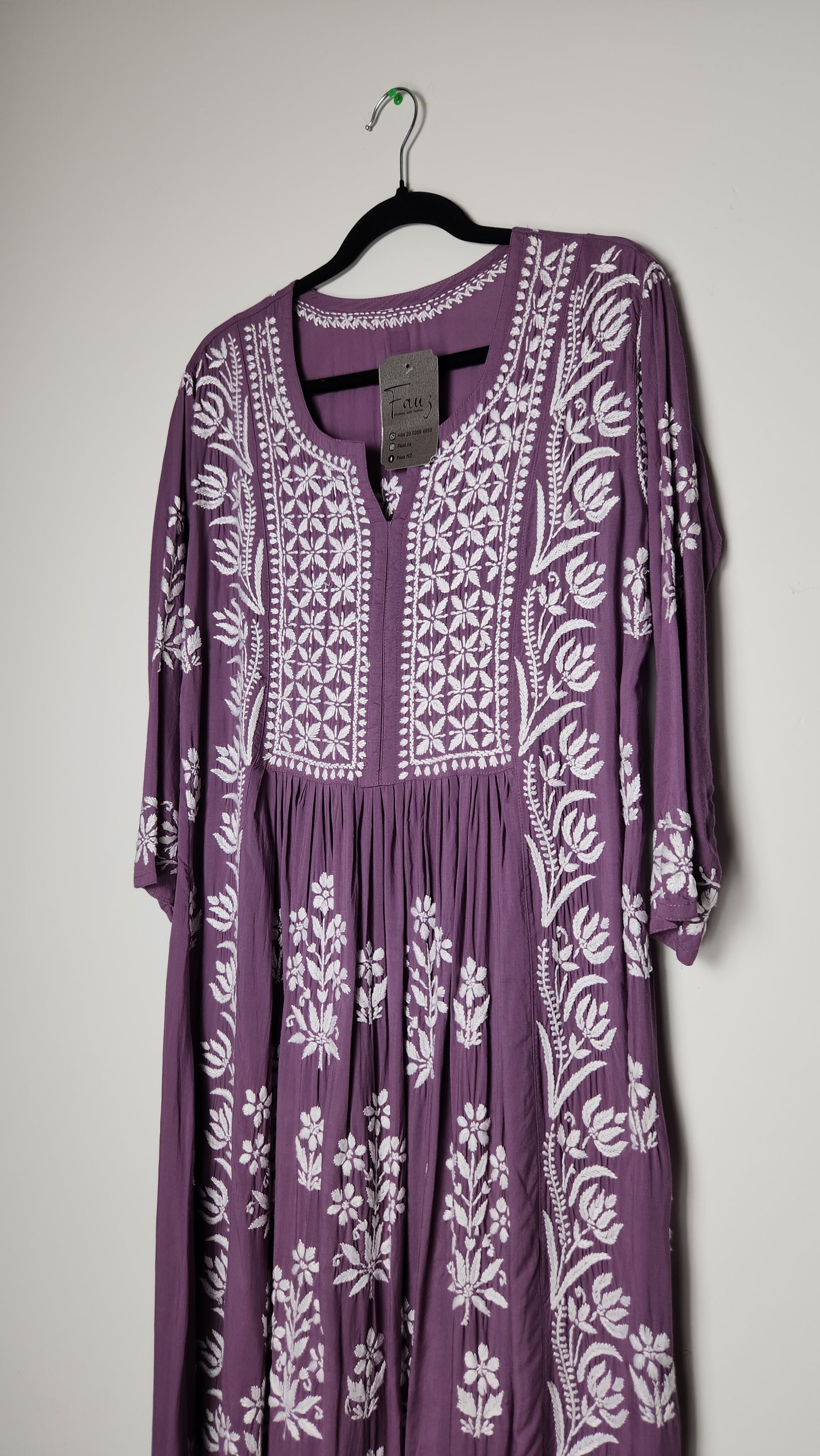 Purple dress with white floral pattern on a light gray background. Shop the world’s first best collection of elegant kurtis, beautiful maxi dresses, and premium cordsets—affordable, stylish, and crafted for boutique lovers in Auckland, New Zealand, and Australia. Premium quality meets cheap prices in fashion that’s both modest and stunning.
