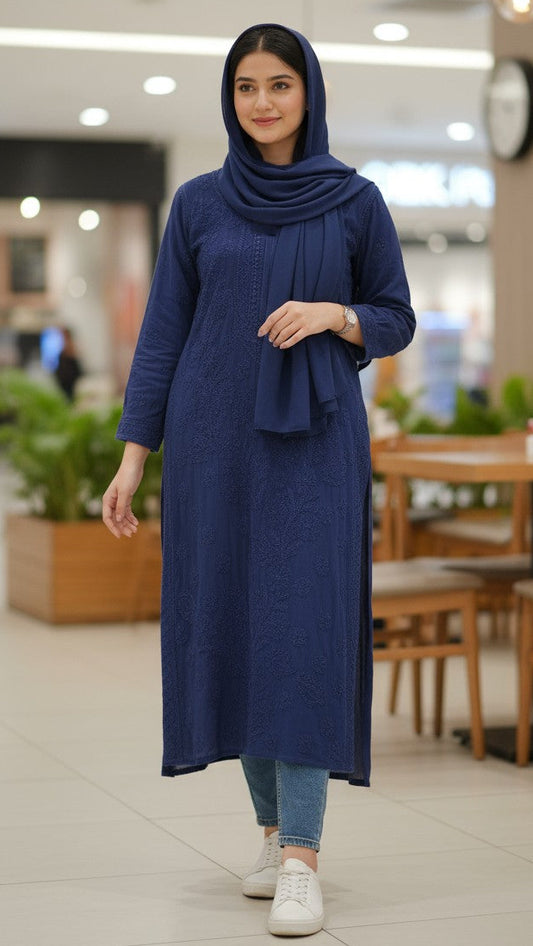 Woman wearing a blue dress and headscarf in an indoor setting. Shop the world’s first best collection of elegant kurtis, beautiful maxi dresses, and premium cordsets—affordable, stylish, and crafted for boutique lovers in Auckland, New Zealand, and Australia. Premium quality meets cheap prices in fashion that’s both modest and stunning.