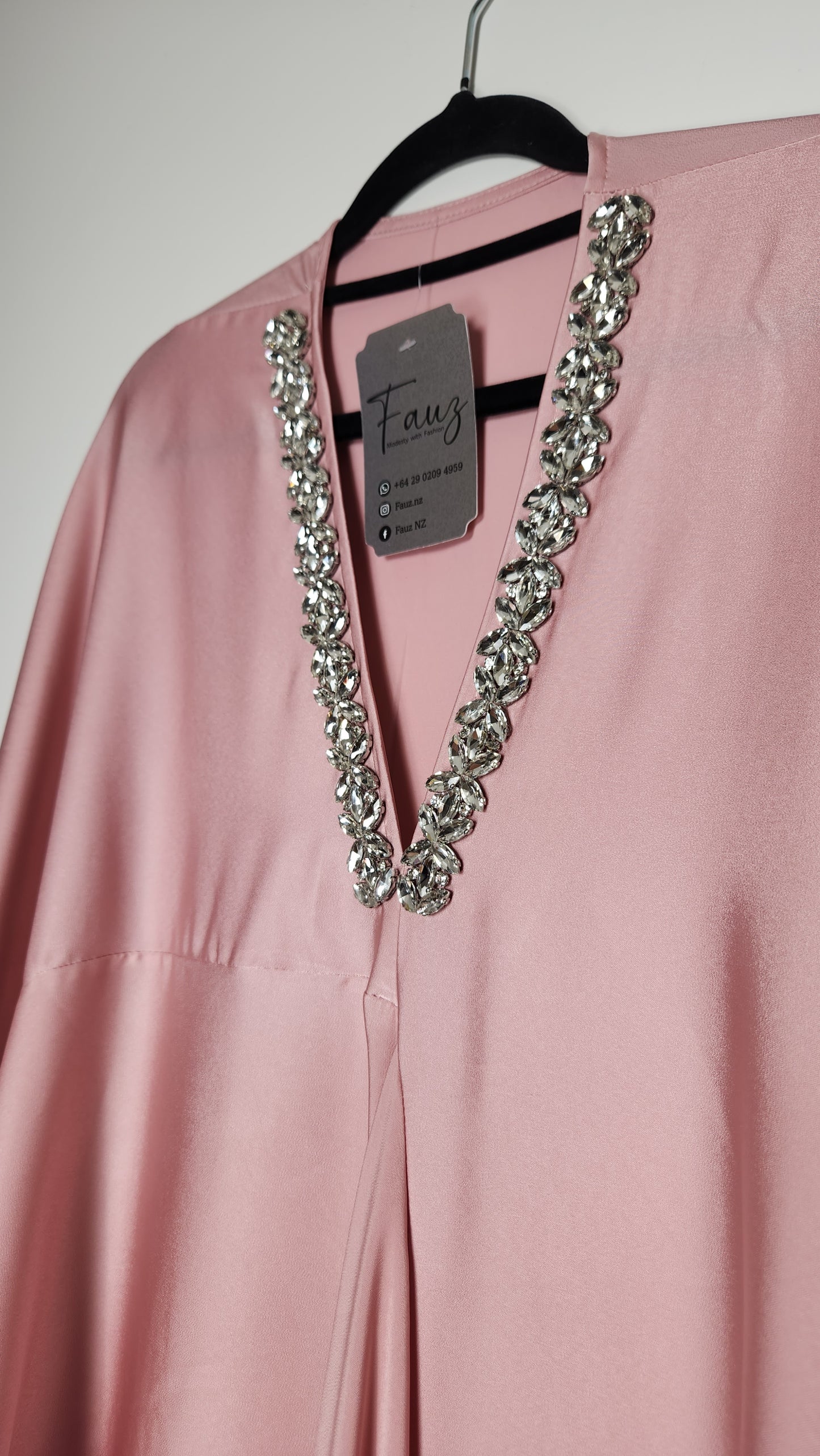 Close-up of a pink garment with a decorative chain on a plain background. - Beautiful maxi dress with lace detailing—affordable luxury from New Zealand.
- Best-selling kurti design, perfect for Australia’s summer events.
- Premium quality cordset in soft satin, styled with modest flair.
- Affordable maxi dress with floral embroidery, ideal for Auckland brunches.
- World’s first best cordset in pastel tones—crafted for boutique lovers.
- Elegant kurti with gold accents, designed for New Zealand’s modern woma