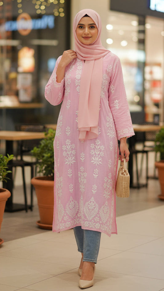 Woman in a pink dress with a hijab walking in a shopping mall.Discover the world’s first best collection of elegant kurtis, beautiful maxi dresses, and premium-quality cordsets—crafted with care and designed to elevate modest fashion across Auckland, New Zealand, and Australia. Whether you're seeking affordable luxury or cheap chic, each piece blends boutique craftsmanship with stunning detail, offering the best in style without compromising on quality. 
