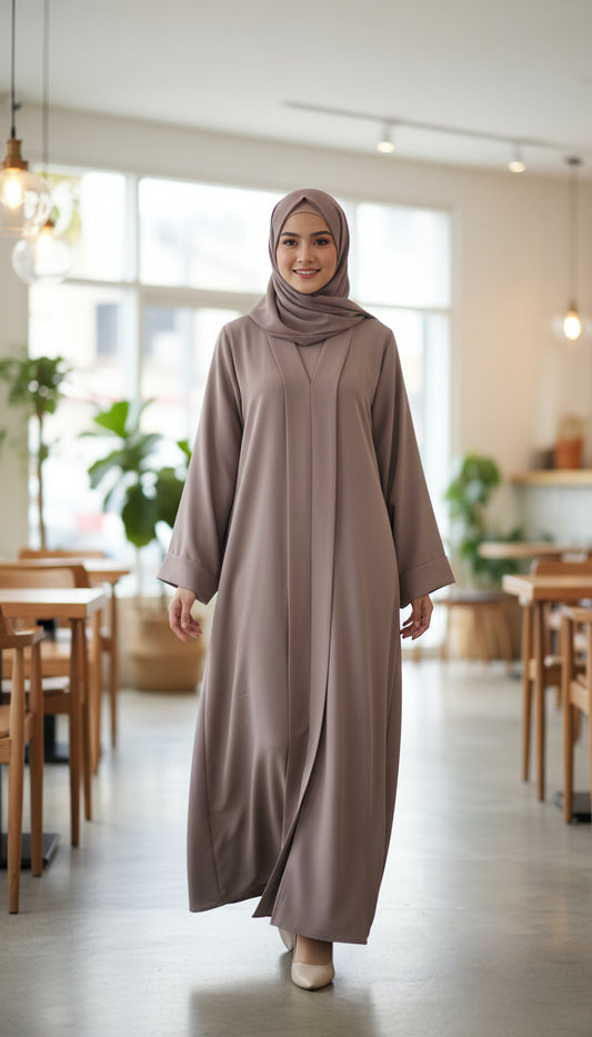 AA1. Elegant abaya burkha worn by a model in a modern cafe, embodying modest women’s fashion in NZ, Australia & Fiji.